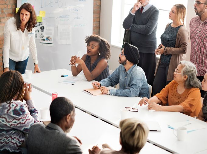Group discussion at conference table.