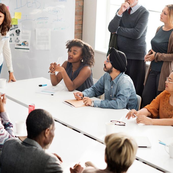 Group discussion at conference table.